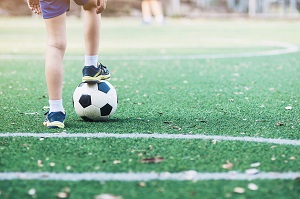 boy standing with ball football
